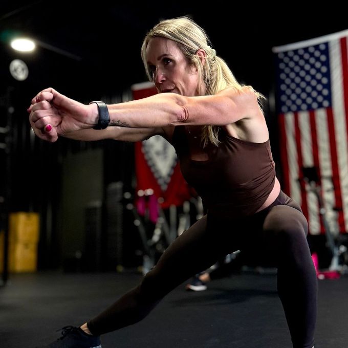 A woman is stretching her arms