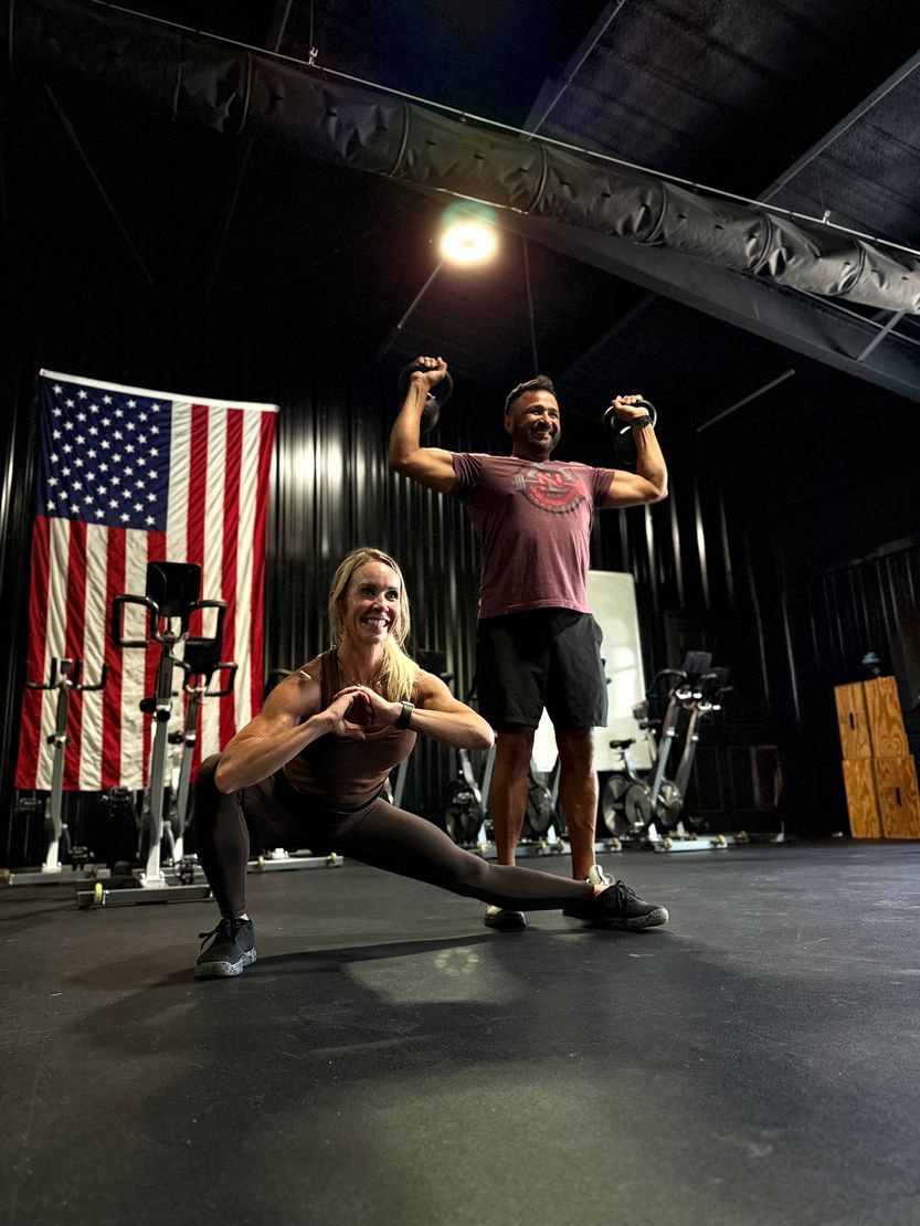 A man and a woman are posing for a picture