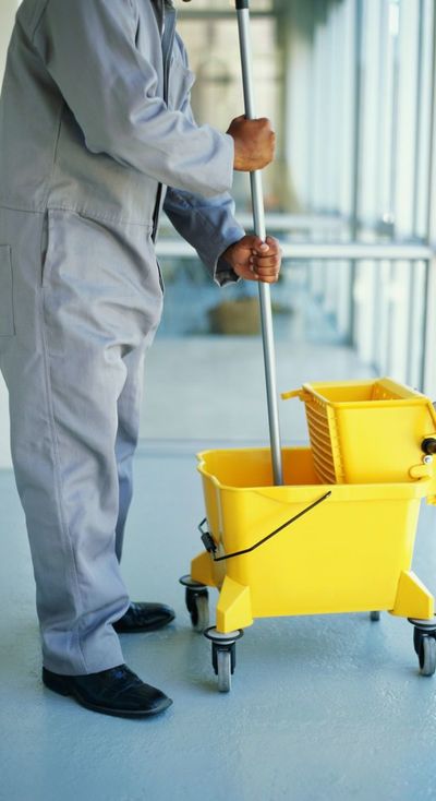 Man using mop for general cleaning in Wellington 