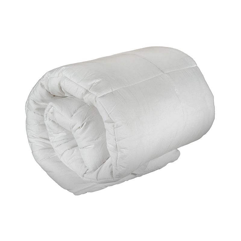 A white comforter is rolled up on a white background.