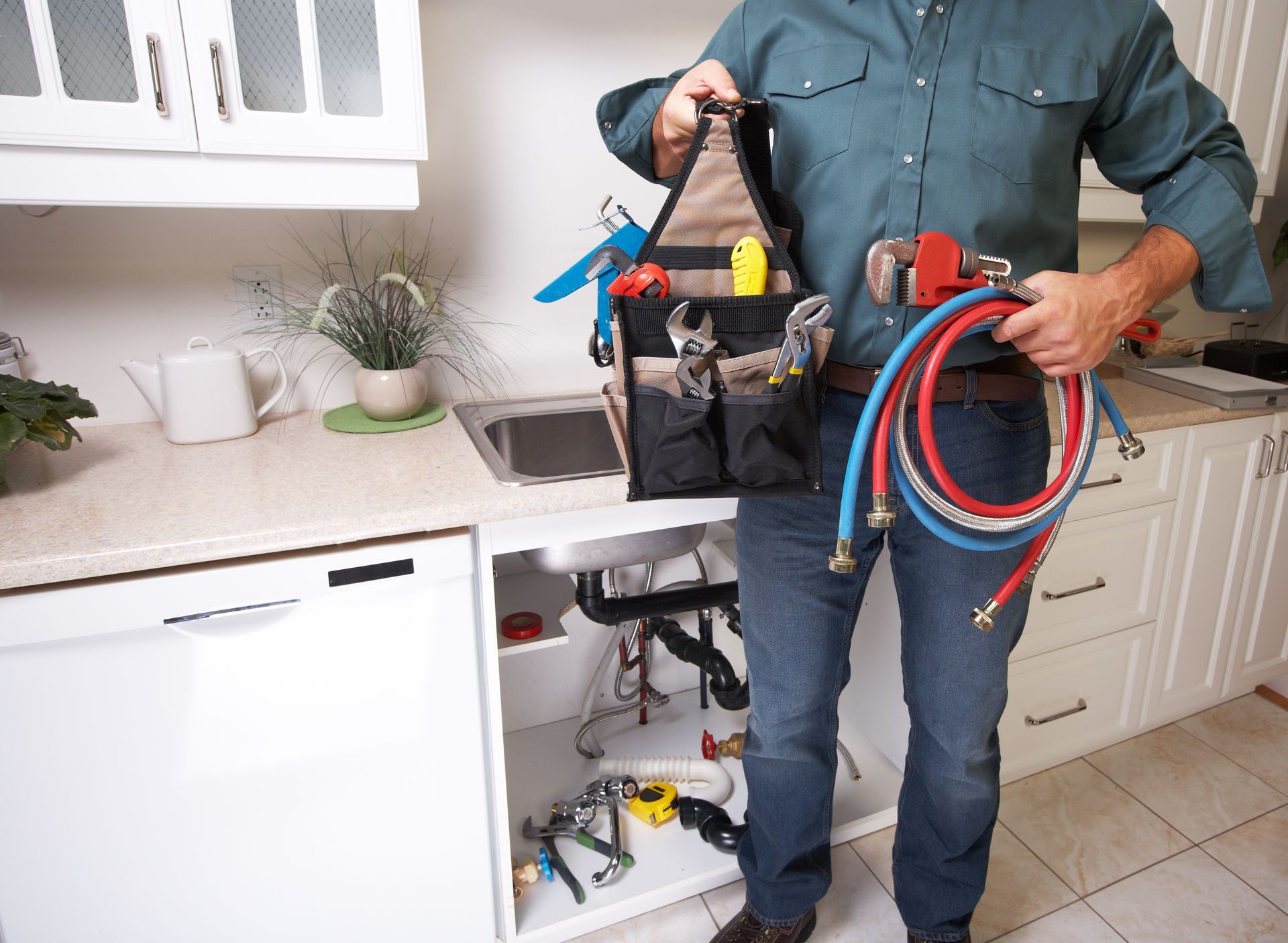 Licensed plumber with equipment ready to handle residential plumbing repairs.