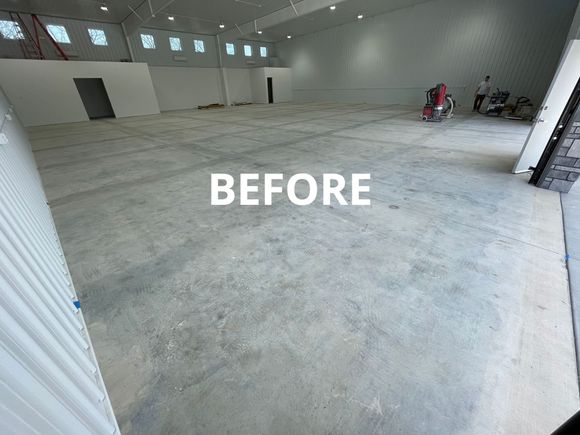 Before photo of warehouse concrete floor, before being finished by Combs Custom Concrete