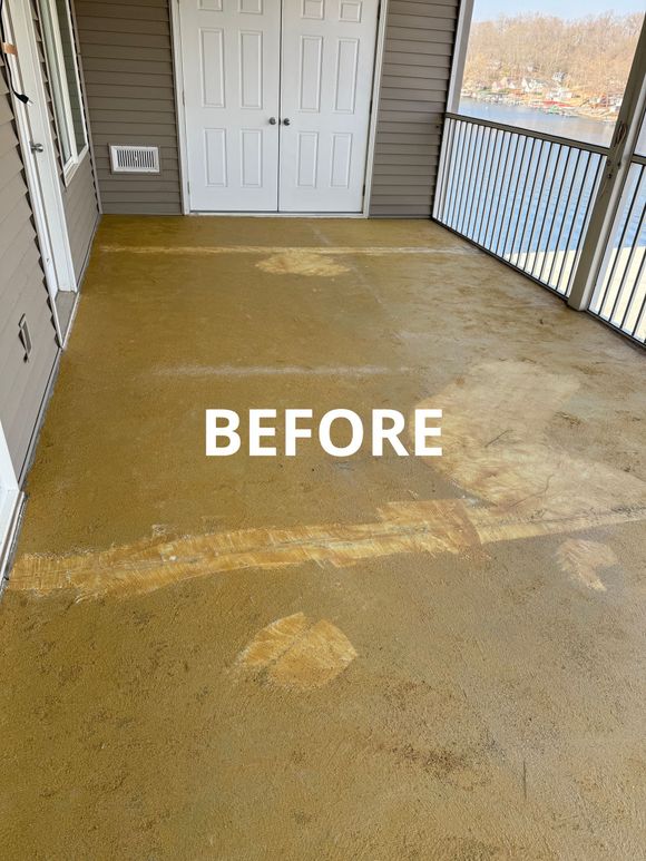 Before image of a back patio covered in glue, grime, and stains
