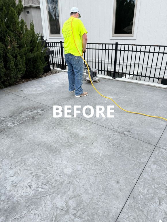 Before image of a front porch and patio while it is being ground and prepared for a finish