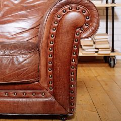 Classic Brown leather armchair in library room
