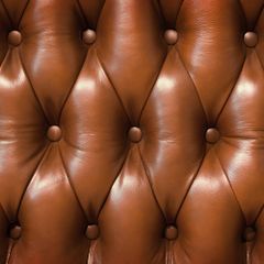 Closeup texture of vintage brown leather sofa for background