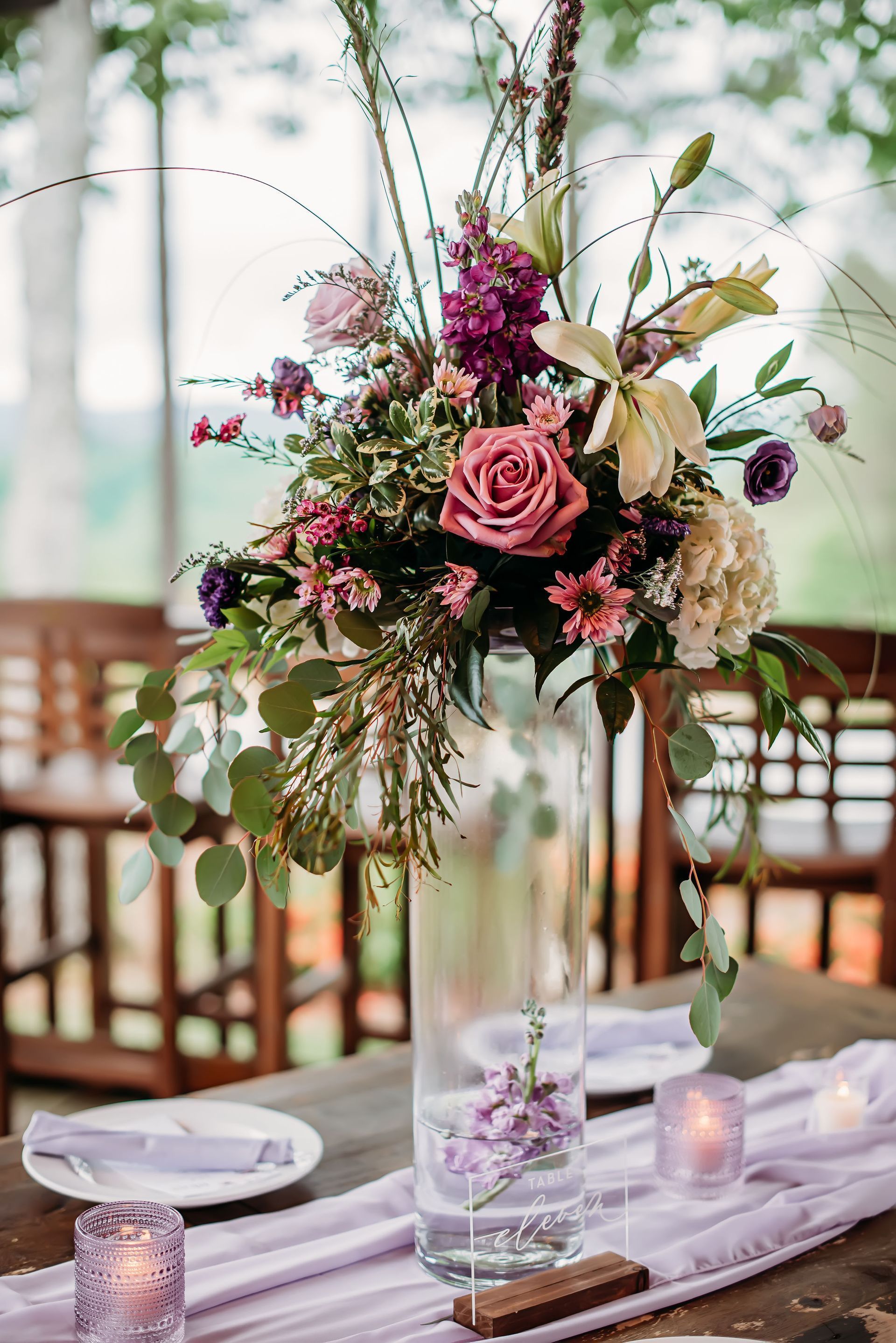 A vase filled with flowers is sitting on a table.