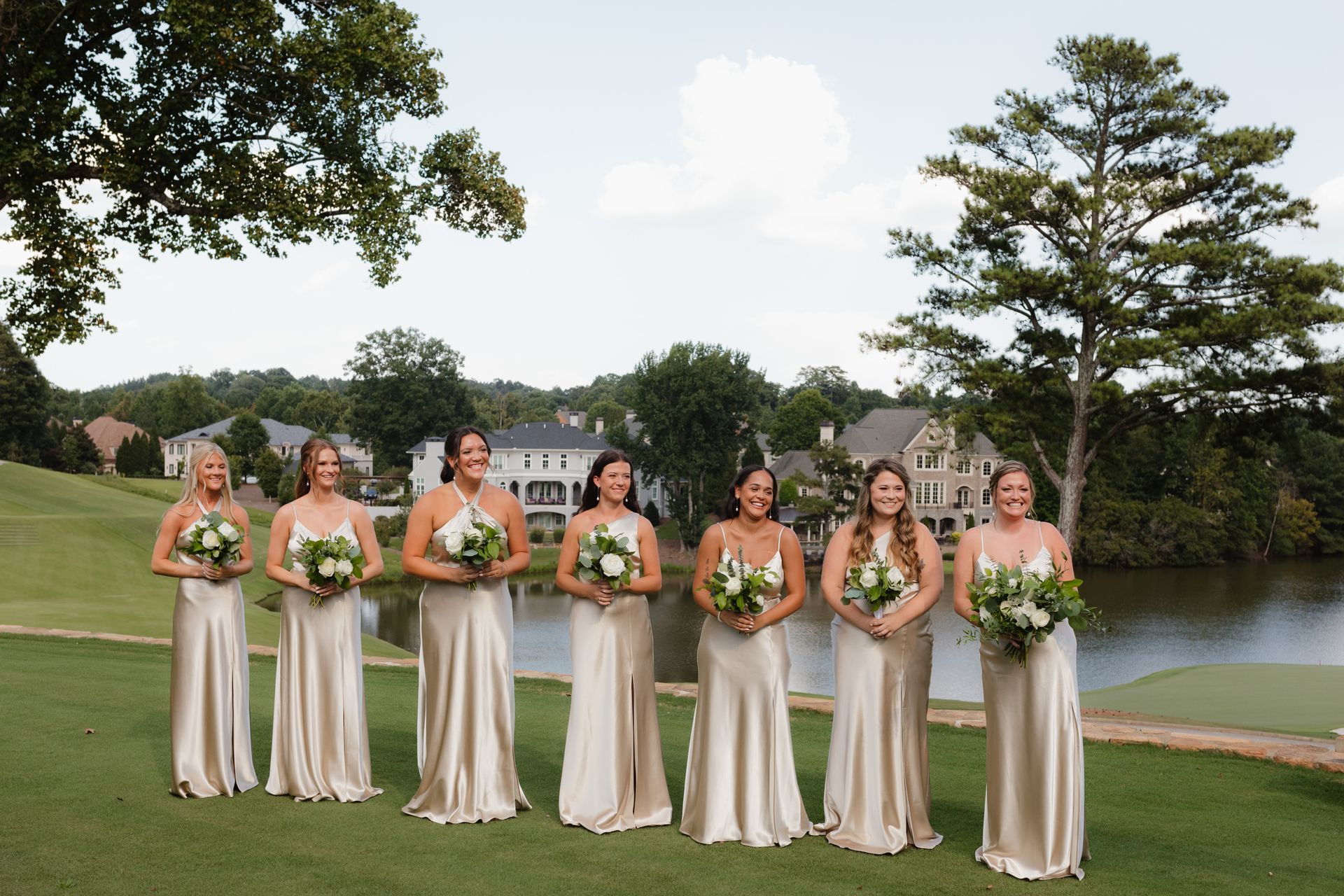 The bride and her bridesmaids are posing for a picture