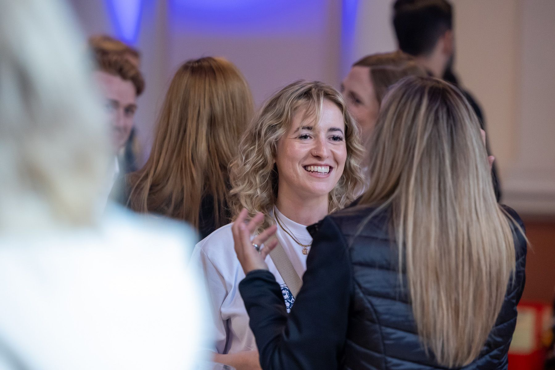 event photographer berkshire, 2 females chatting at conference in London 