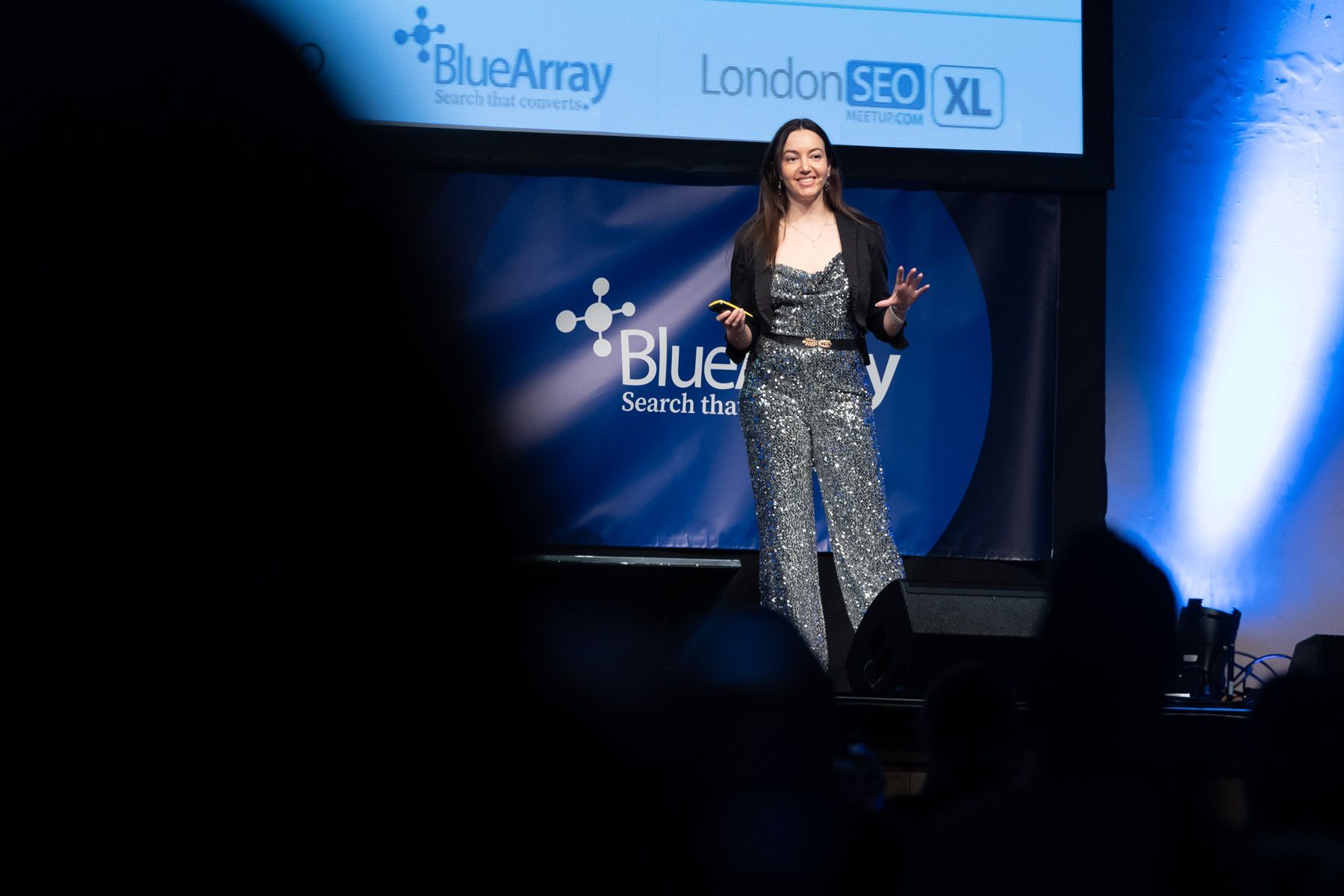 event photographer berkshire, female executive on stage at corporate event