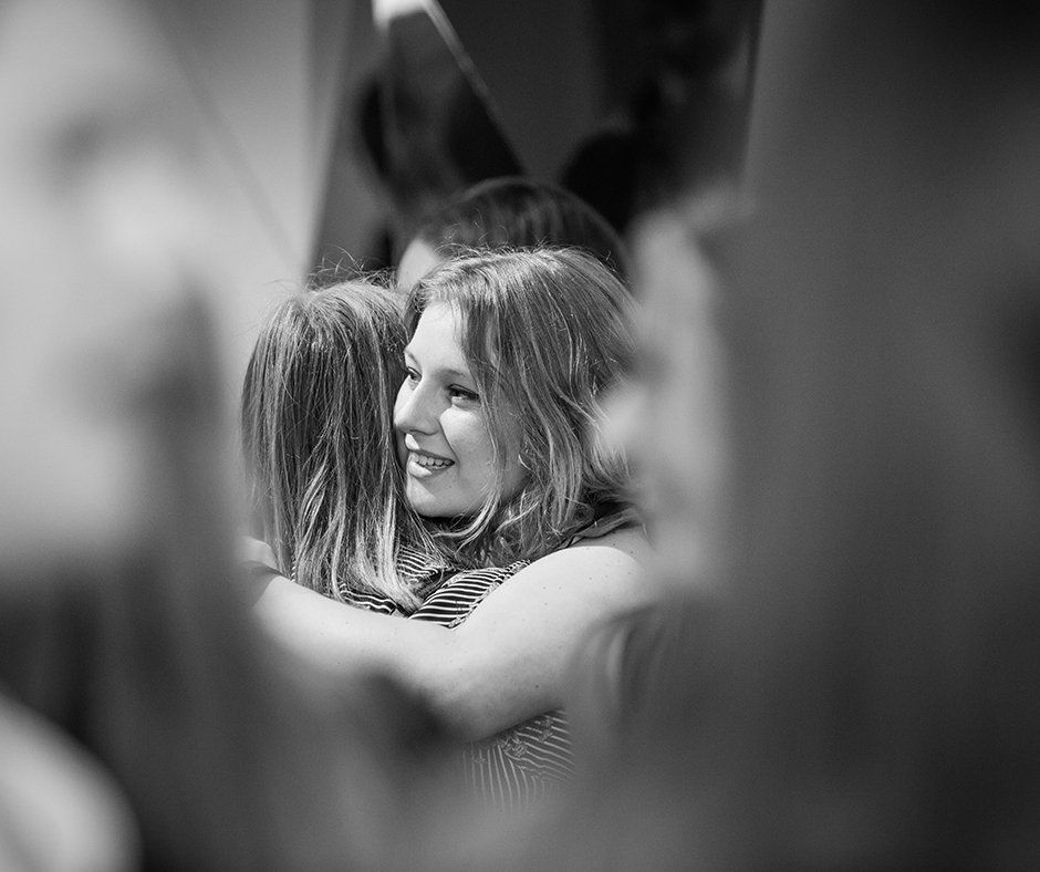 Event photographer Reading females hug