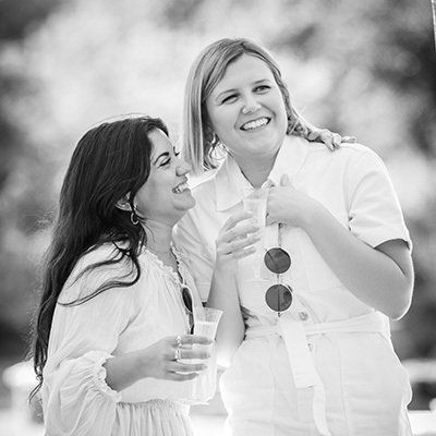 Event photographer Reading females hugging