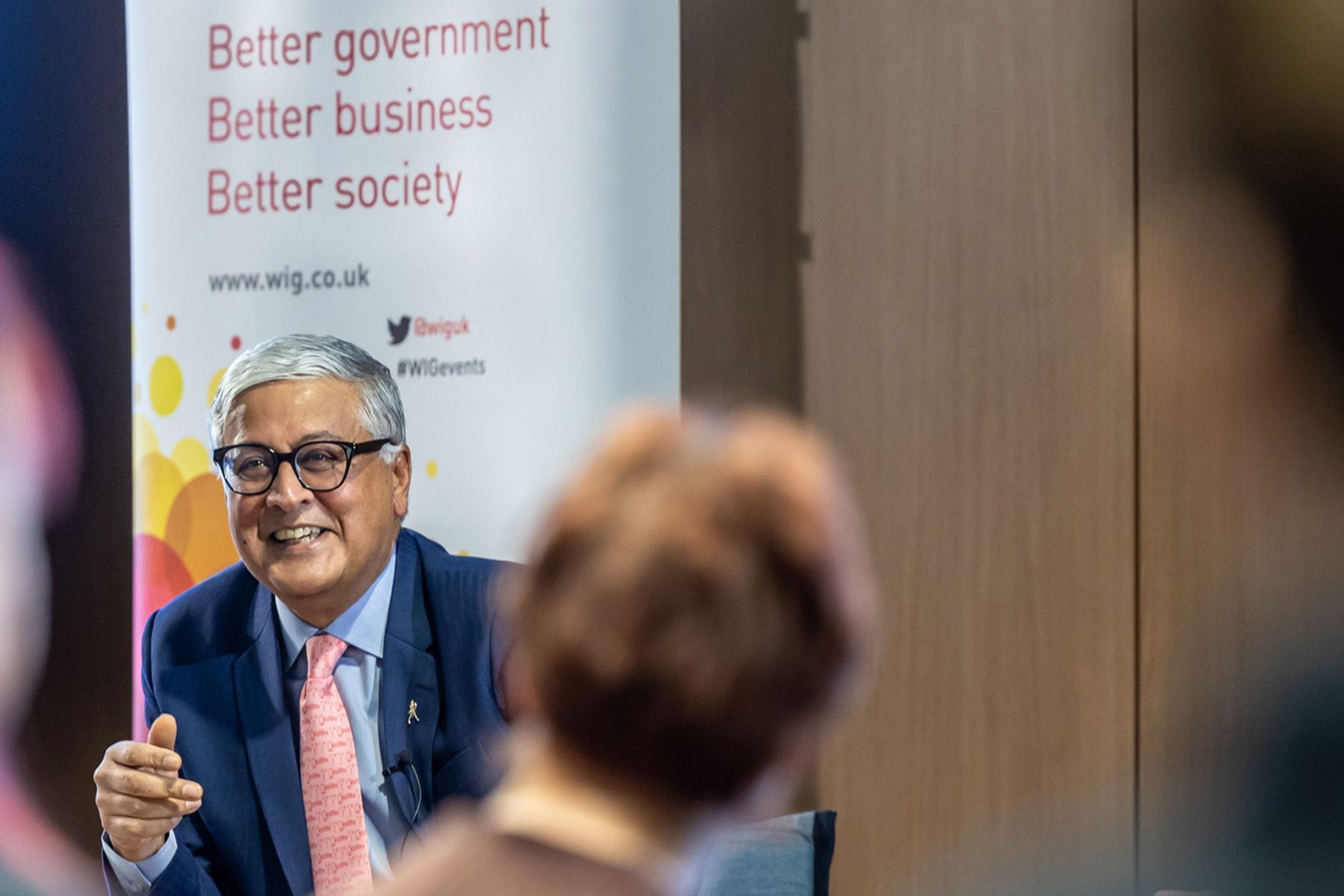 event photography reading, male speaker on stage at corporate event