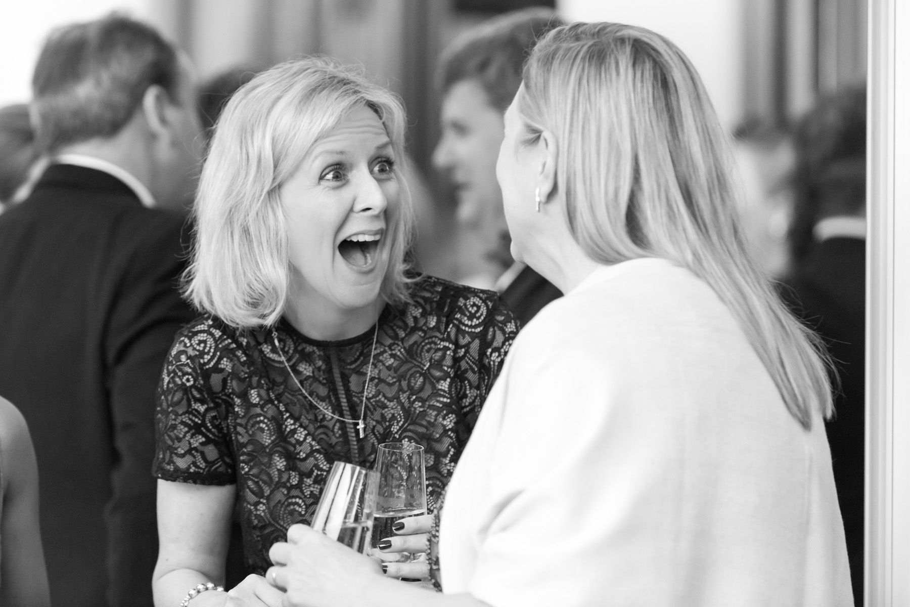 event photography reading, lady at event laughing with colleague