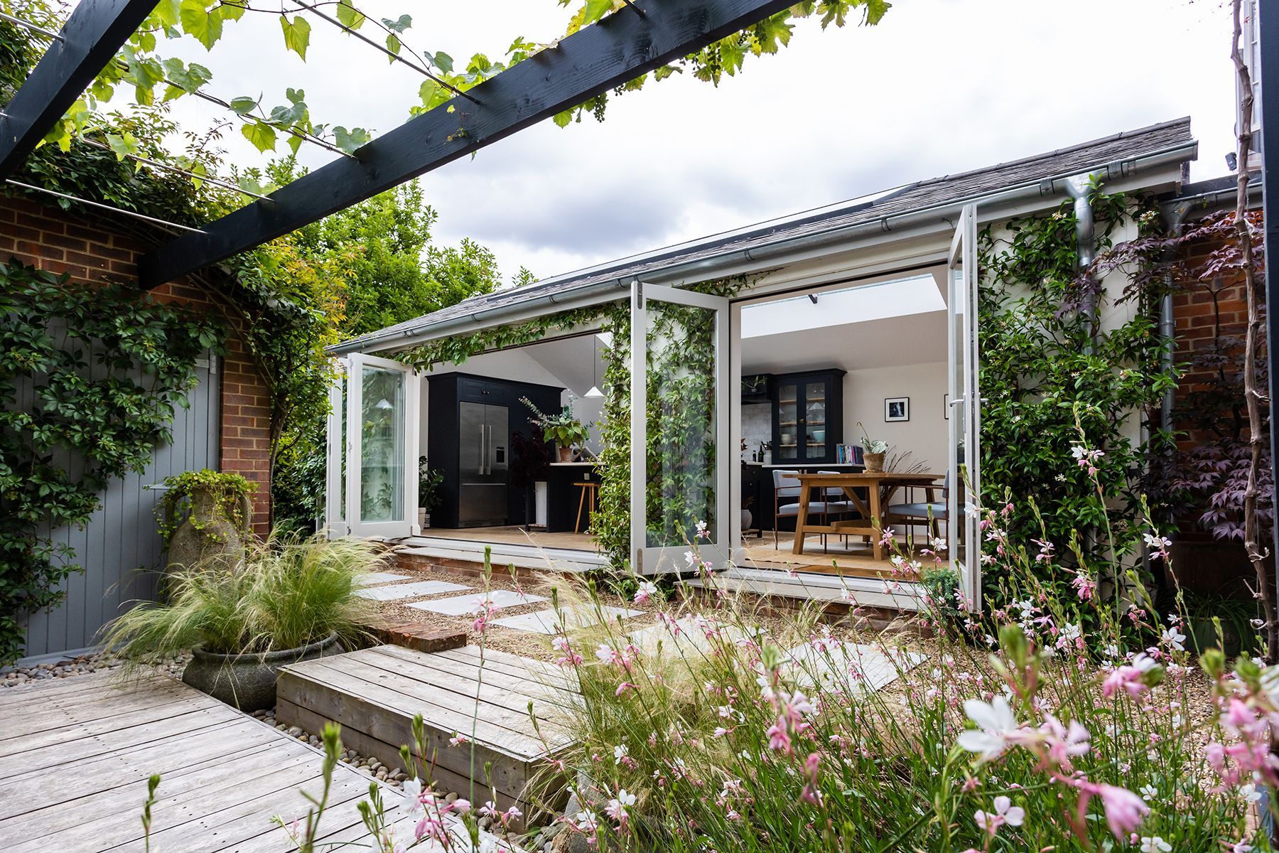 property photography berkshire, beautiful garden looking into open plan kitchen with bifold doors