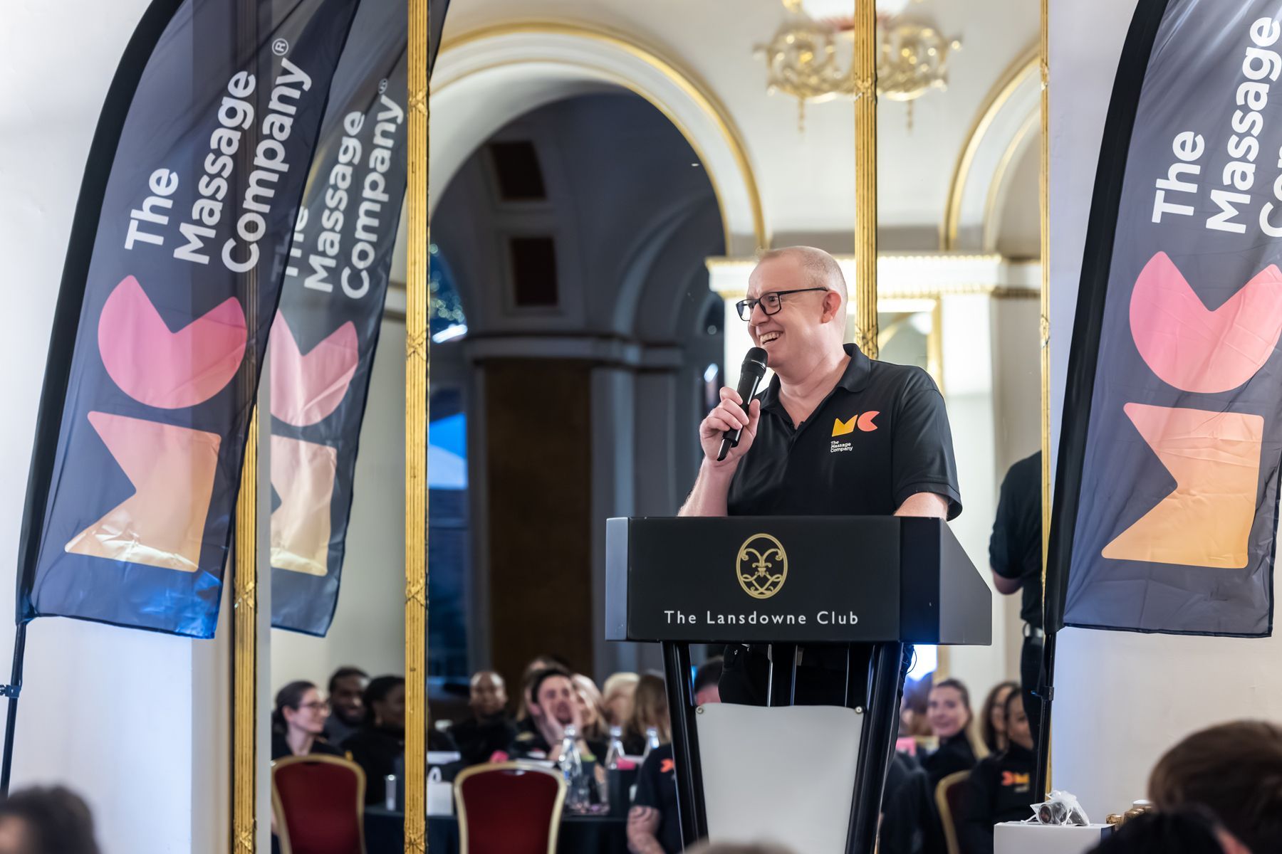 event photographer reading, speaker on stage at corporate event