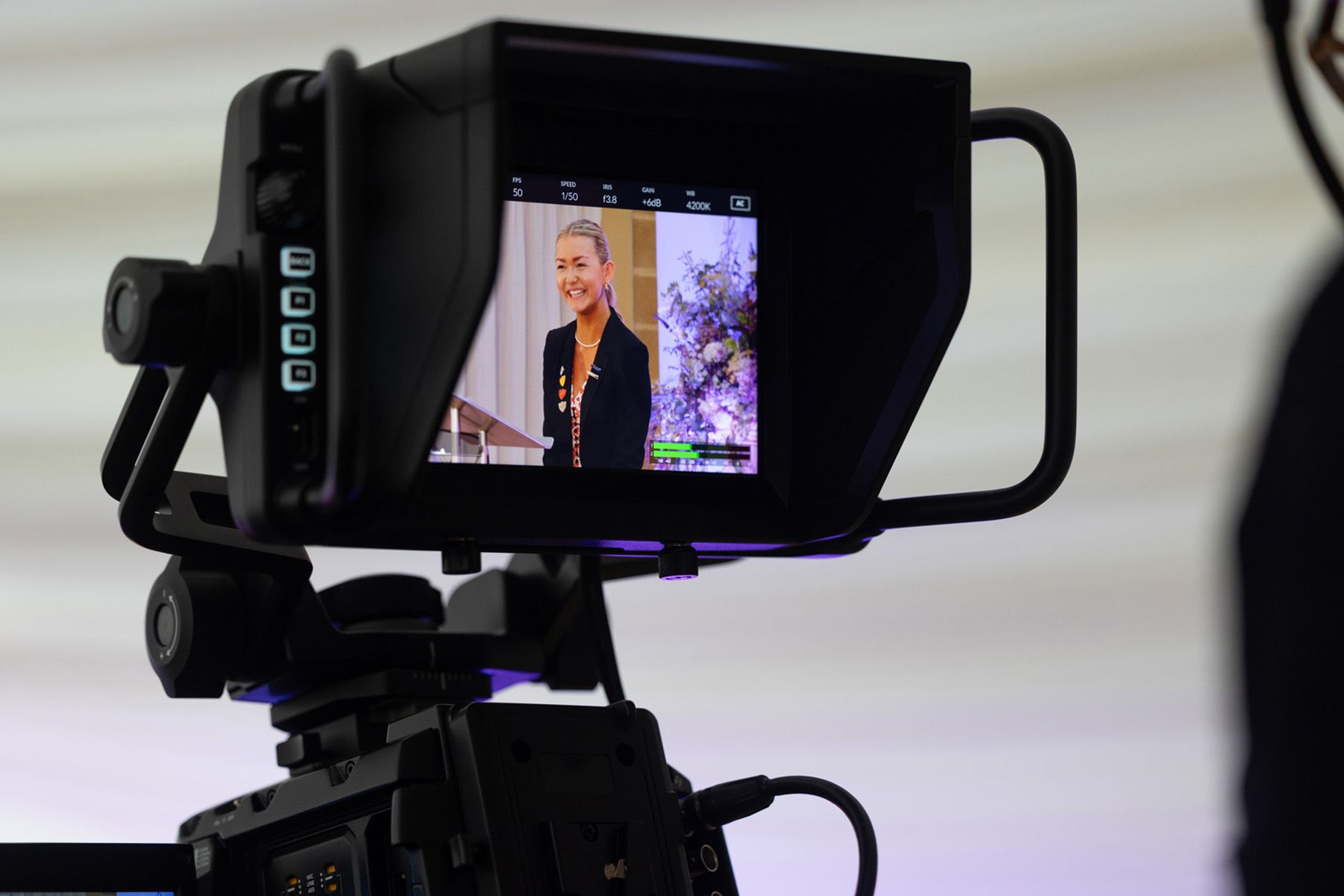 event photography berkshire, female speaker caught on videographer screen