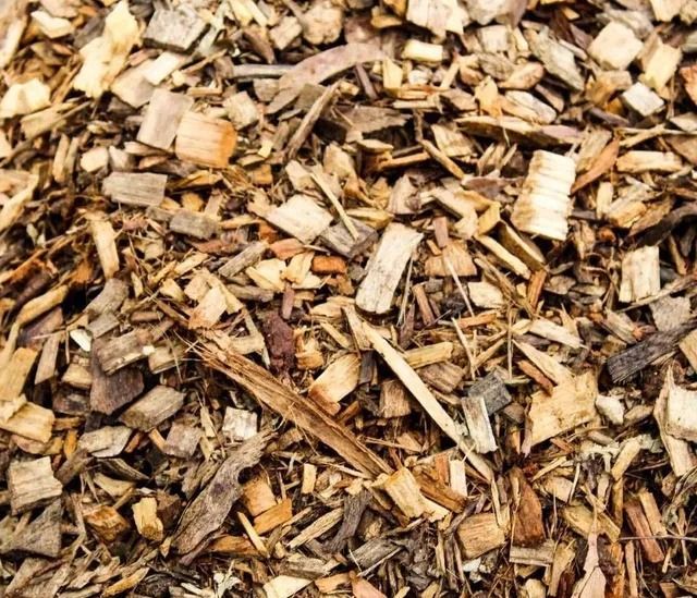 Pile of Brown and Tan Wood Chips, Mulch — Blue Dog Earthmoving Landscape Supplies in Nambucca Heads, NSW