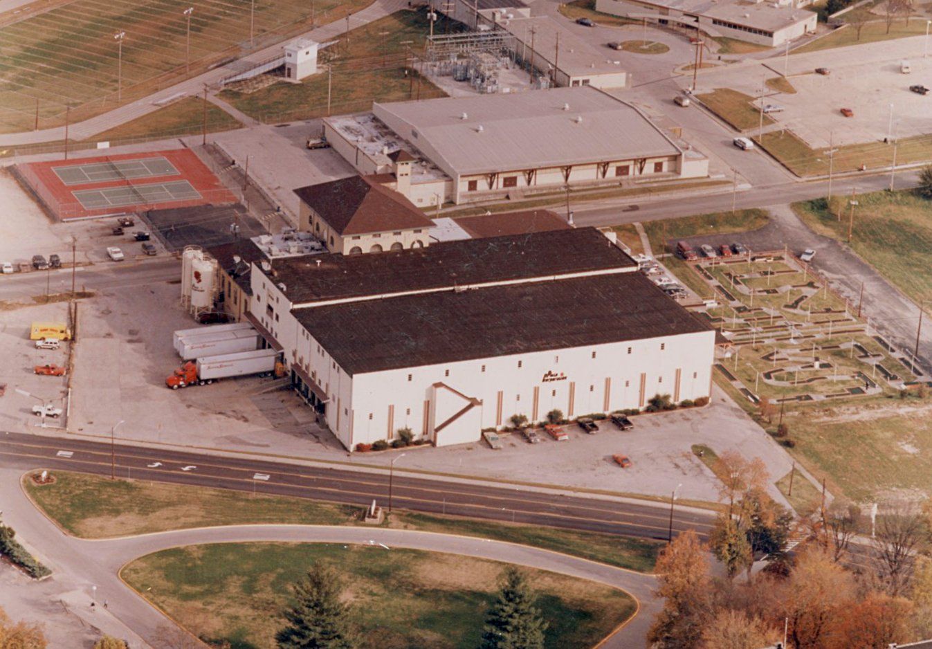 An aerial view of a Pluto building with a brown roof