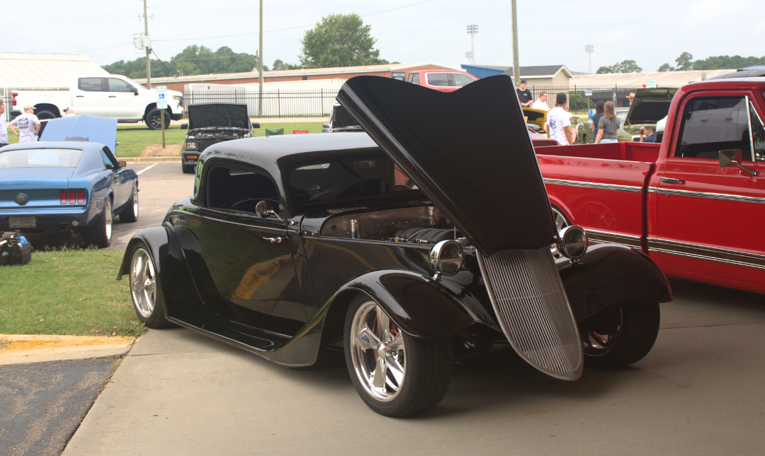 black roadster with raised hood