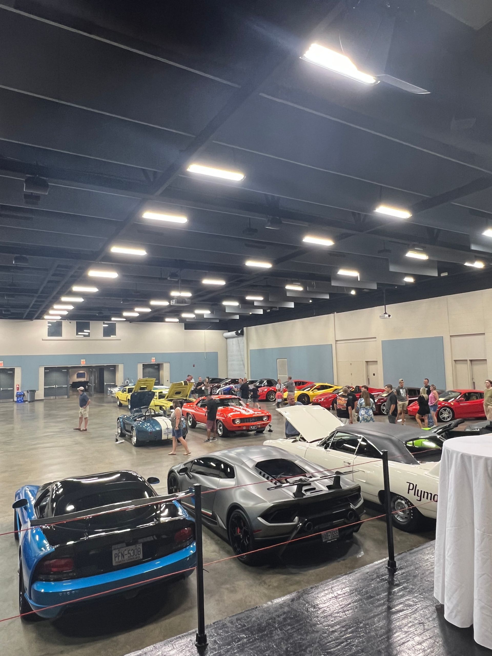 Indoor display of numerous sports cars