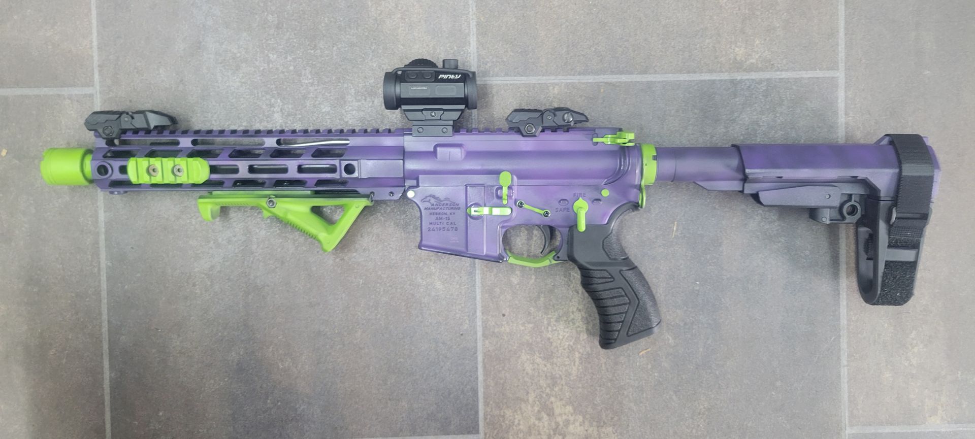 A photo of violet and green gun 