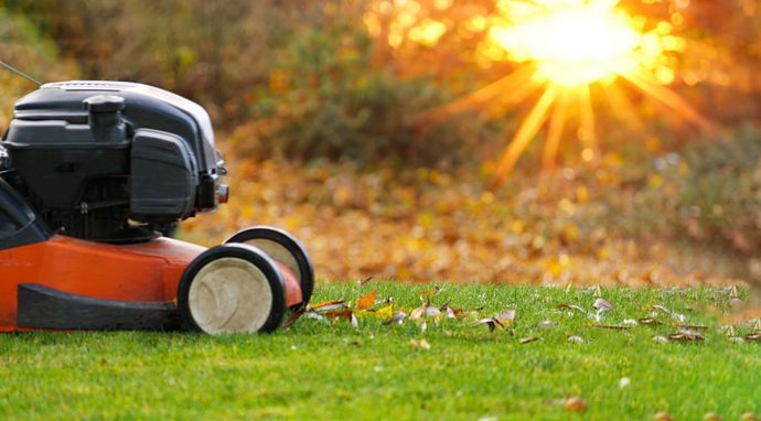 A picture of a lawn mower on a lawn.