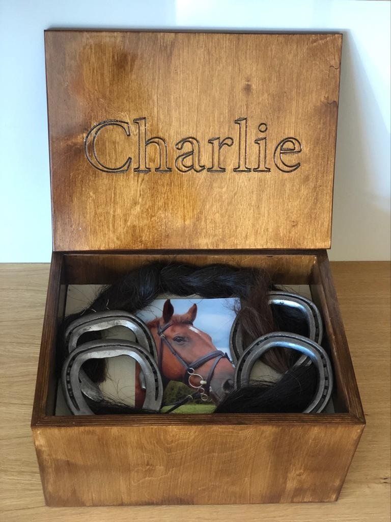 Casket with ashes, horse shoe castings with main & tail cuttings