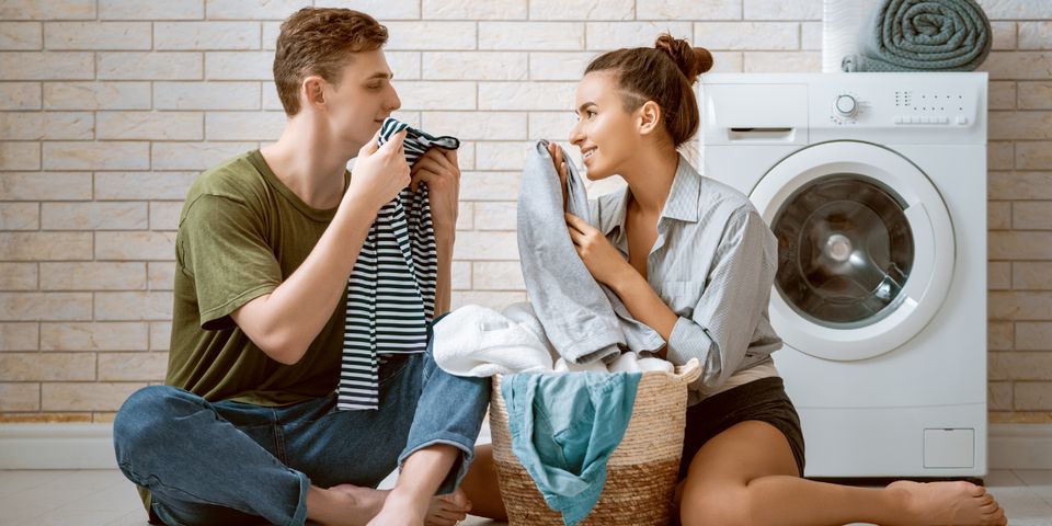 Couple Smelling the Clothes — Elyria, OH — Expert Appliance Solutions Couple Smelling the Clothes — Elyria, OH — Expert Appliance Solutions
