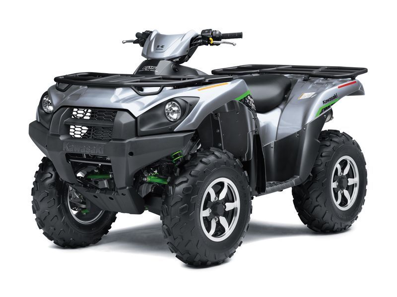 Silver Kawasaki ATV on a white background, with black accents, green details, and rugged tires.