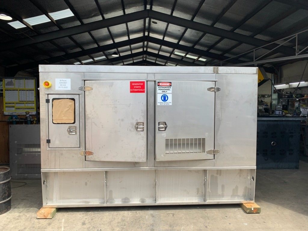 A Metal Lathe Machine With a Cylindrical Metal Workpiece in a Workshop — KAC Generation & Mechanical Pty Ltd In Bungalow, QLD