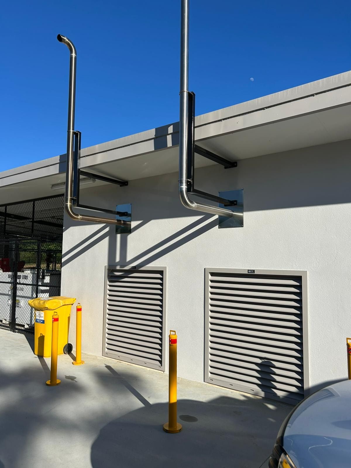 Person Sharpening a Knife Blade With a Machine in a Workshop — KAC Generation & Mechanical Pty Ltd In Bungalow, QLD