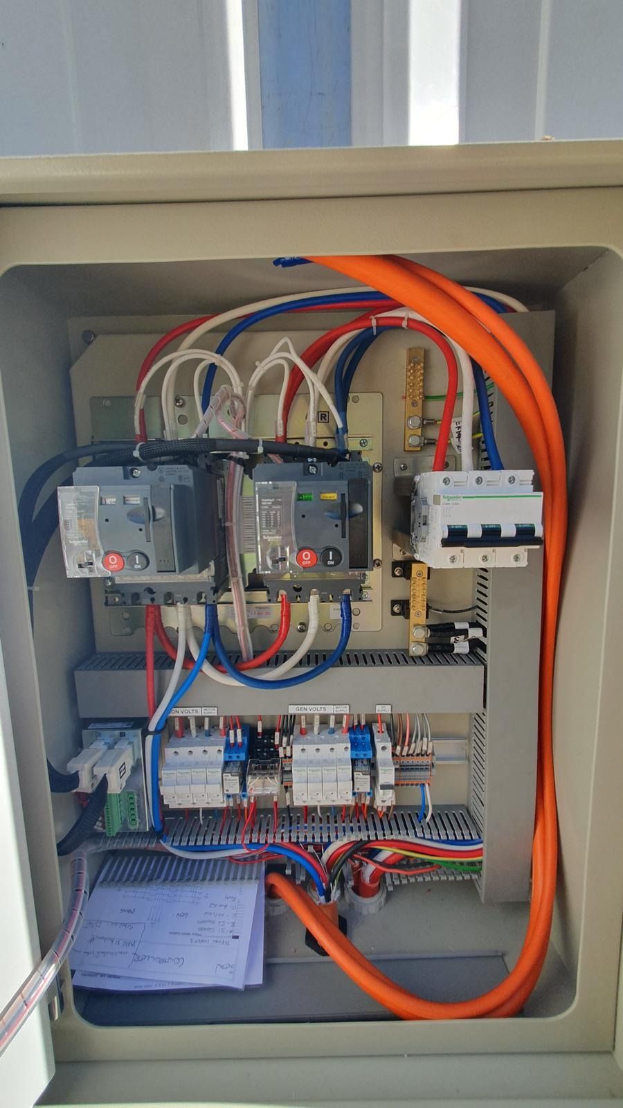 Electrician Using a Multimeter to Measure Voltage — KAC Generation & Mechanical Pty Ltd In Bungalow, QLD