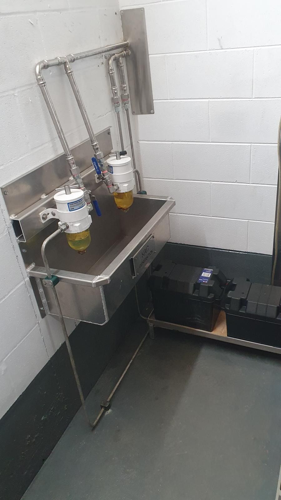 Green Machinery and Pipes Inside a Ship's Engine Room — KAC Generation & Mechanical Pty Ltd In Bungalow, QLD