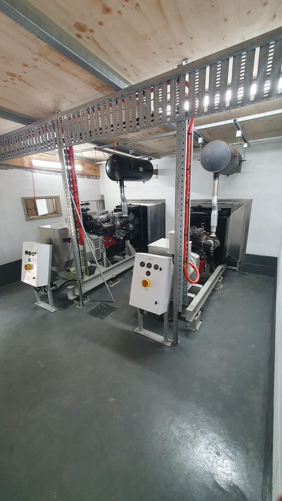 Electrical Control Panels in a Bright Room With Many Gauges — KAC Generation & Mechanical Pty Ltd In Bungalow, QLD
