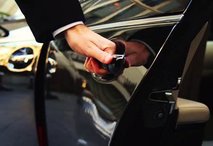 Professional Chauffer Opening Car Door