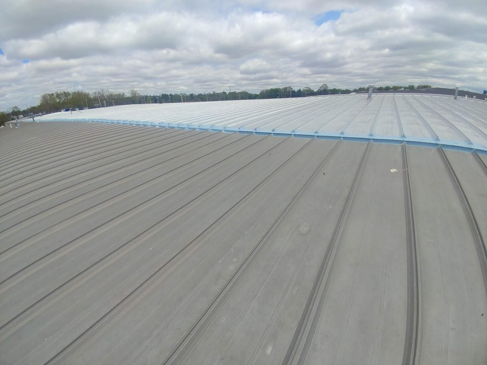The roof of a building is covered in plastic.