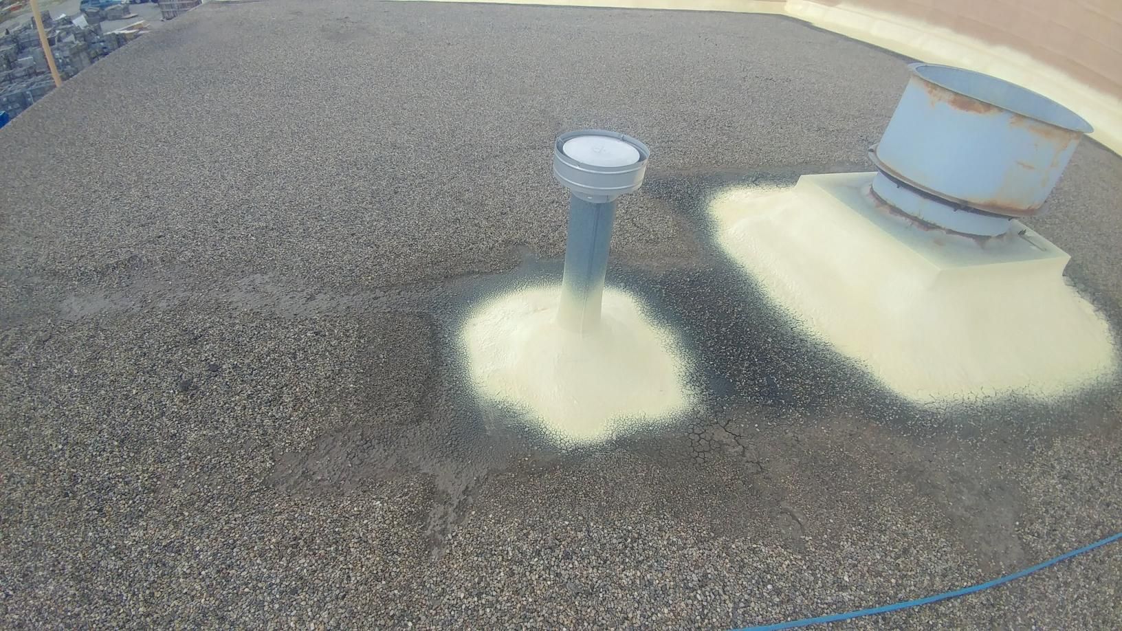 A large pile of gravel with a hole in the middle of it.