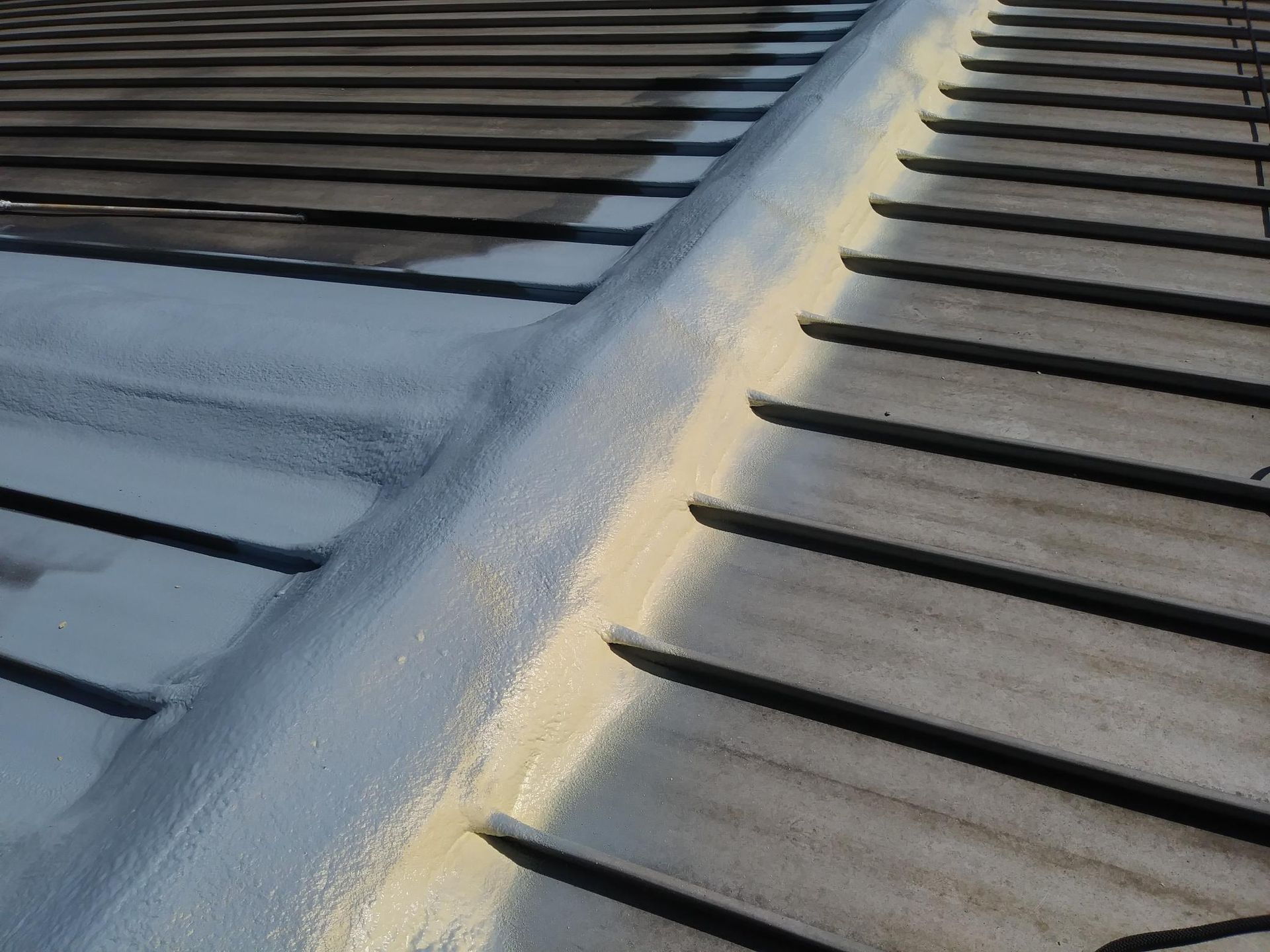 A close up of a roof with a shadow on it