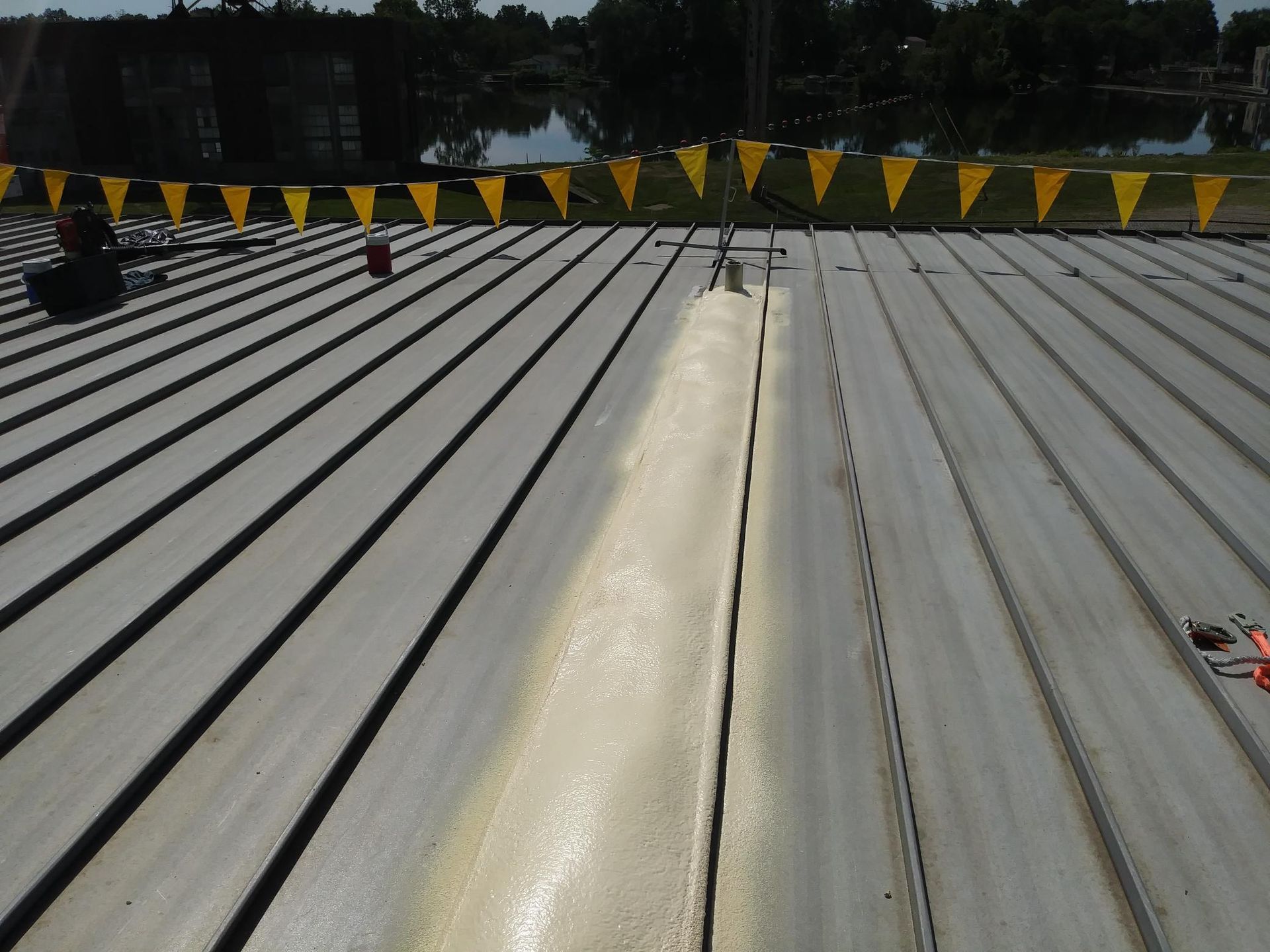 A roof with a lot of yellow flags on it
