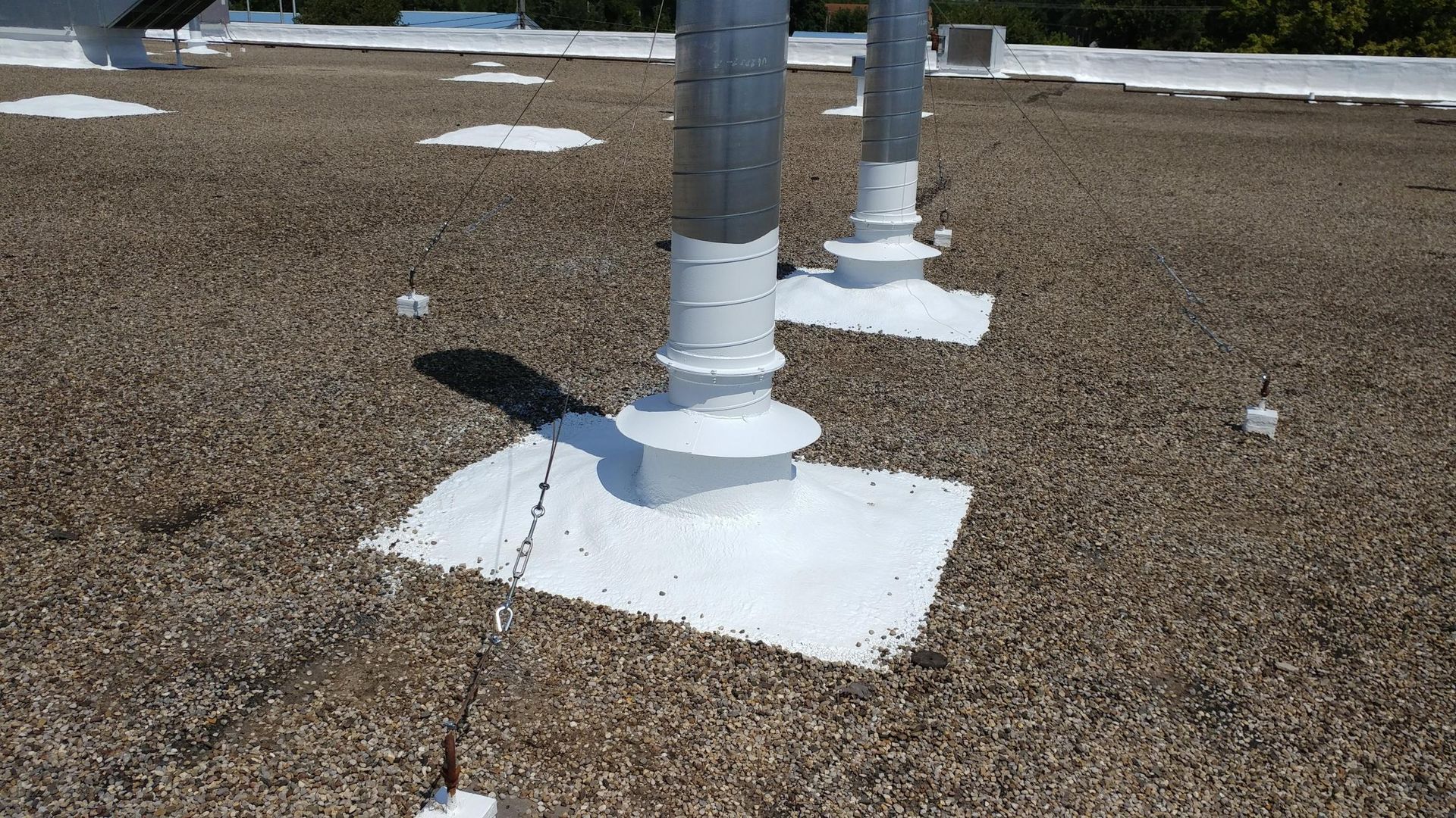 A roof with a lot of pipes on it