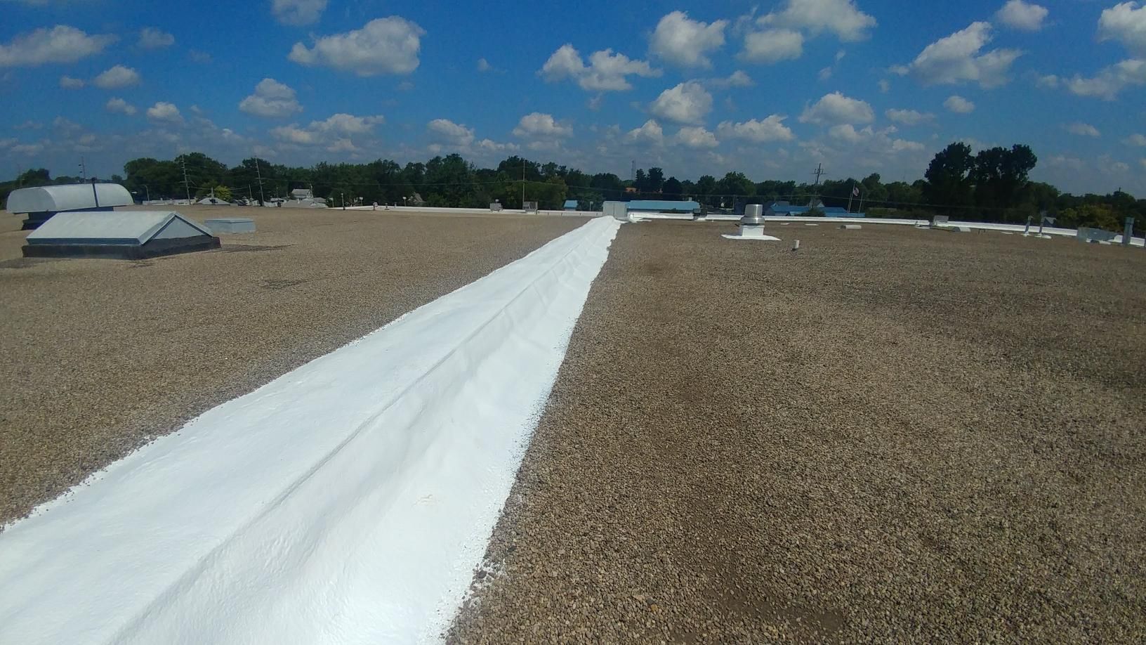 A white line is painted on the roof of a building.