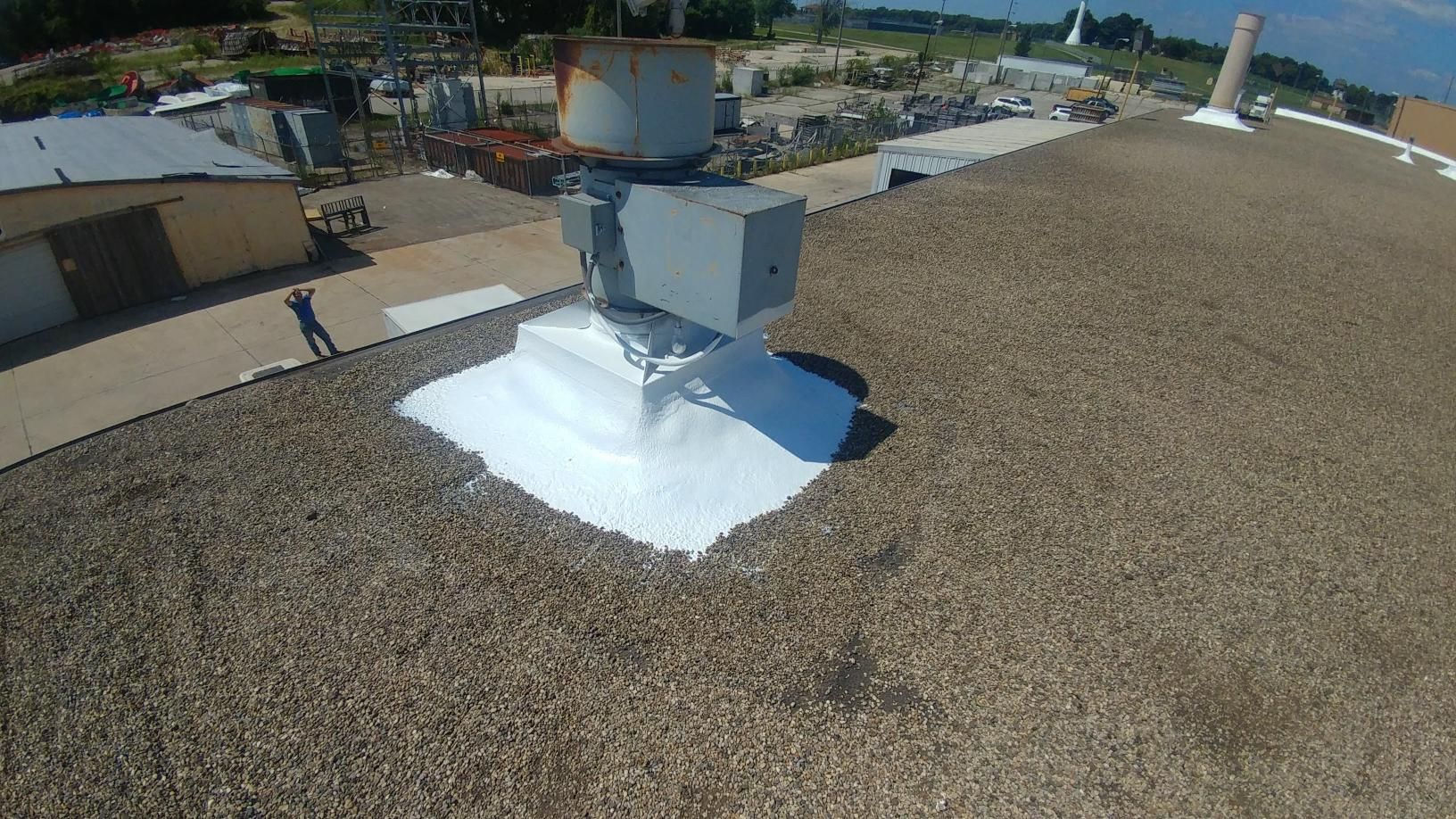 An aerial view of a roof with a chimney on it.