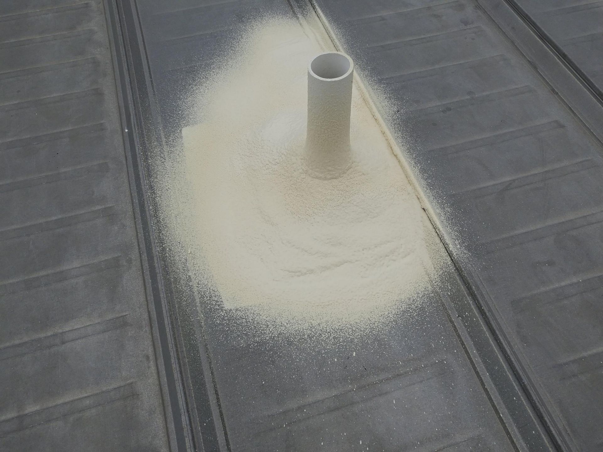 A hole in the roof is covered in white powder