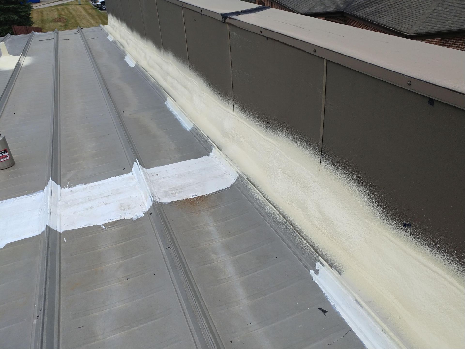 A close up of a roof with white spray paint on it.