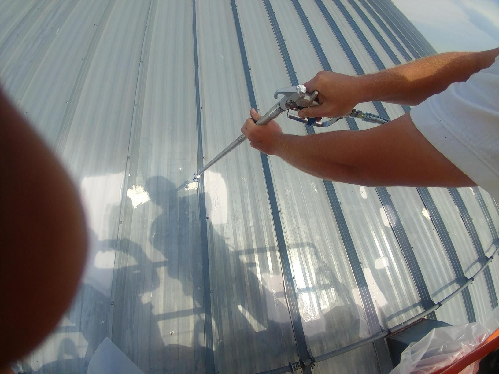 Man working on metal roof