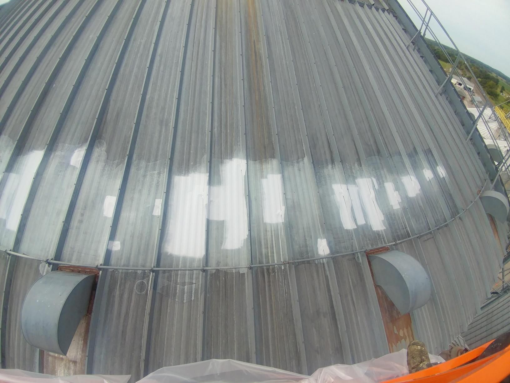 A roof of a building with a few holes in it