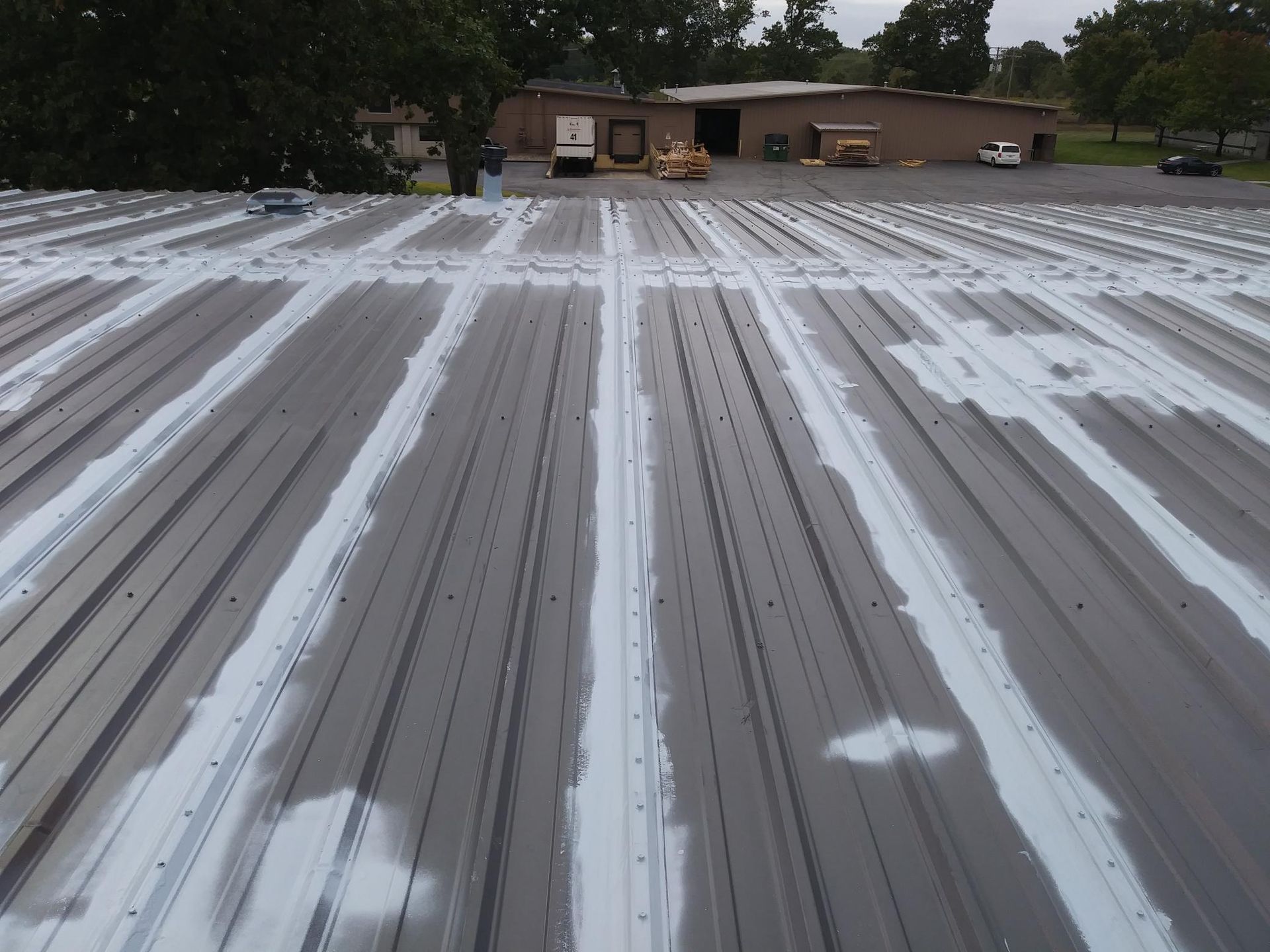 The roof of a building has been painted white