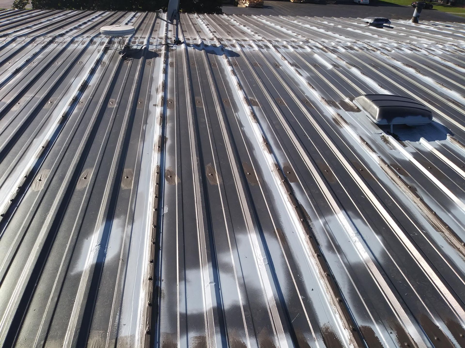 The roof of a building has been painted white