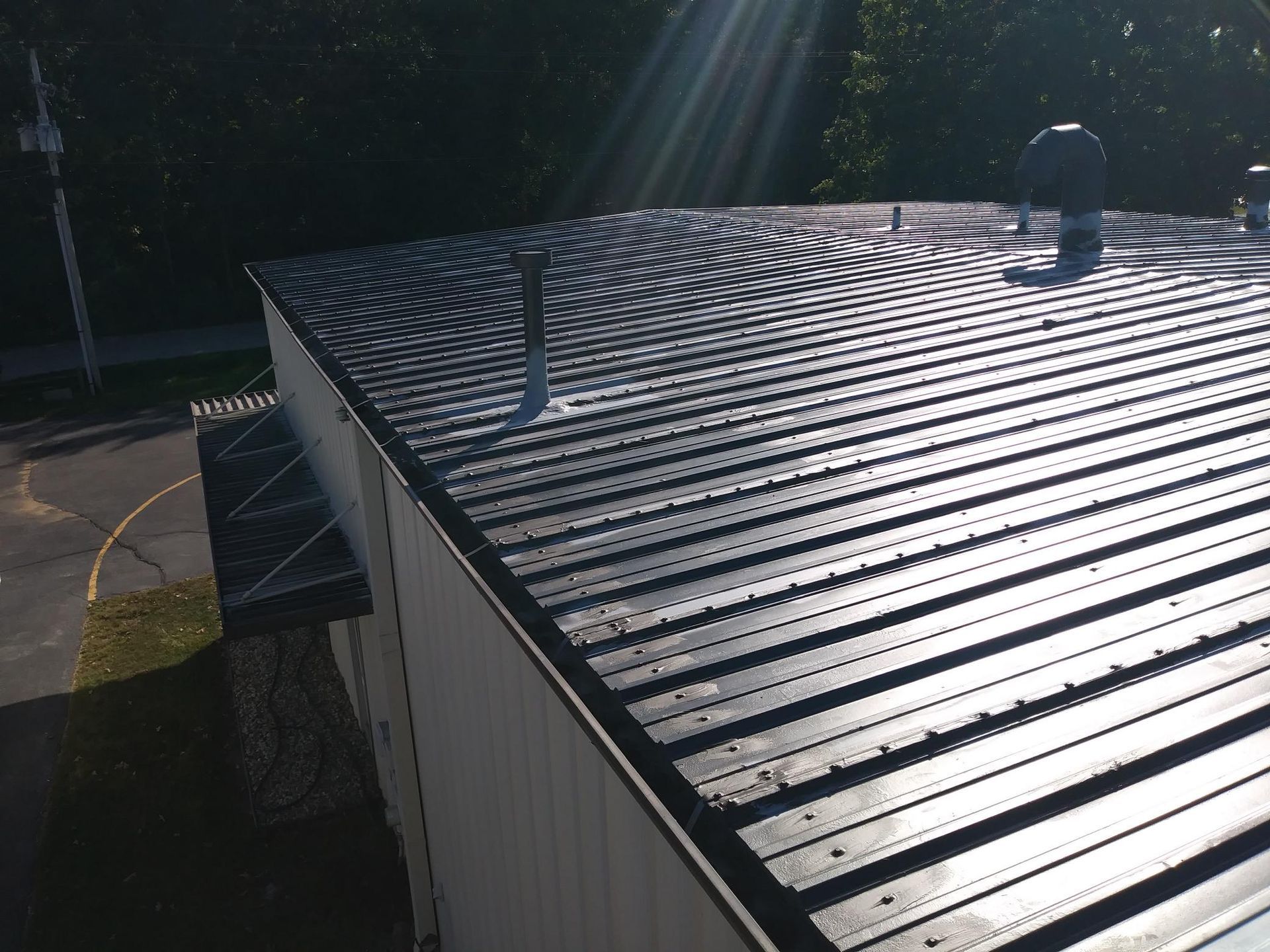 The sun is shining through the roof of a building